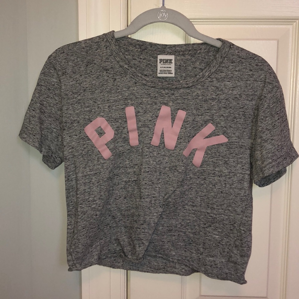 Grey short sleeved shirt. Cropped!